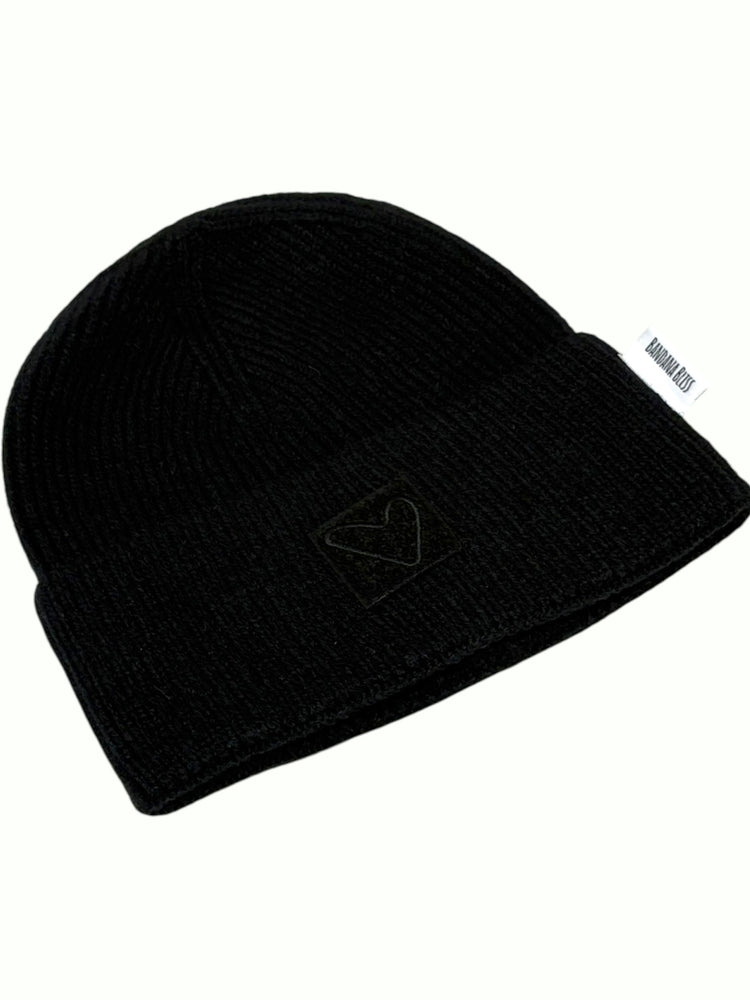 Black Sherpa Heart Beanie from the side, showing the cuff and heart patch