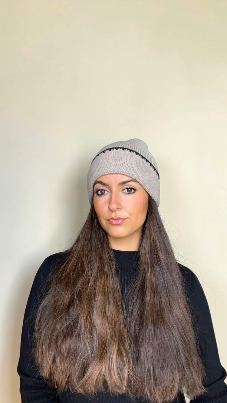 Woman with long hair wearing the Taupe and Black Contrast Stitch Knit Beanie