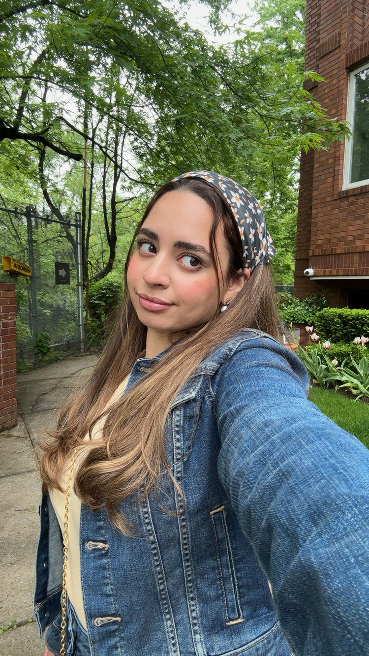 Flower Dreams pre-tied bandana worn as a headband with a denim jacket, outdoor selfie