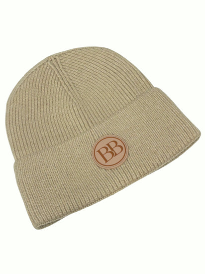 Oatmeal Classic Knit Logo Beanie from the side, showing the cuff and BB logo patch