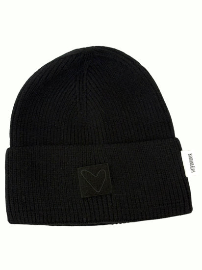 Black Sherpa Heart Beanie laid flat, ribbed cuffed knit with a tonal heart patch
