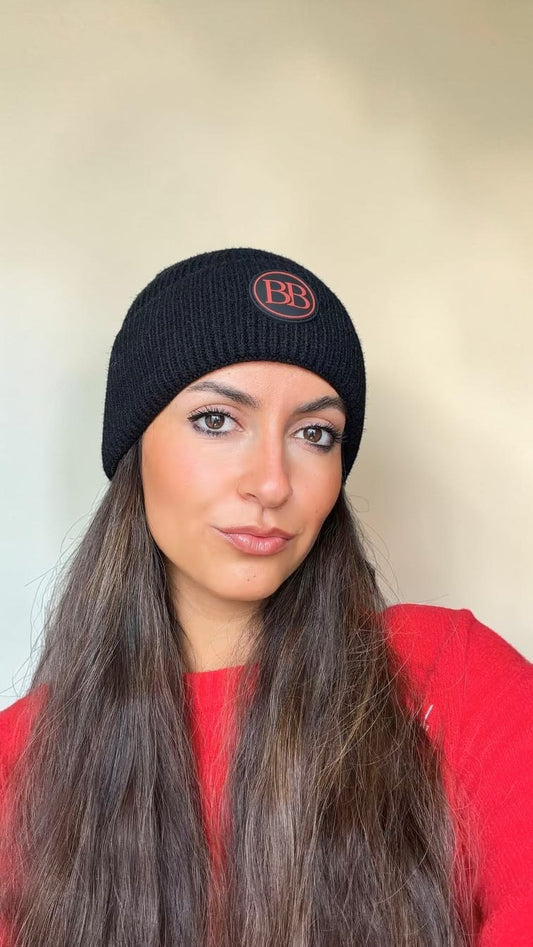 Close-up of the black Classic Knit Logo Beanie with its round BB logo patch