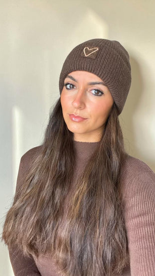 Cocoa brown Sherpa Heart Beanie worn with a mauve sweater, heart patch on the front